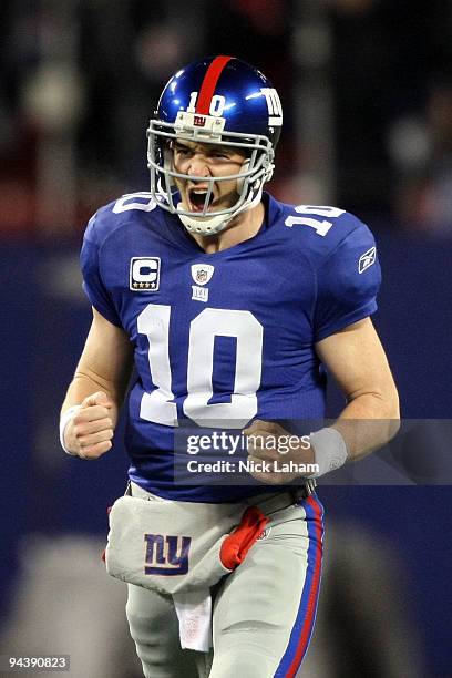 Eli Manning of the New York Giants celebrates after a touchdown pass in the third quarter against the Philadelphia Eagles at Giants Stadium on...