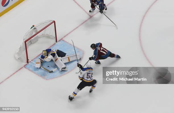 Goaltender Jake Allen of the St. Louis Blues makes a save against Tyson Jost of the Colorado Avalanche at the Pepsi Center on April 7, 2018 in...