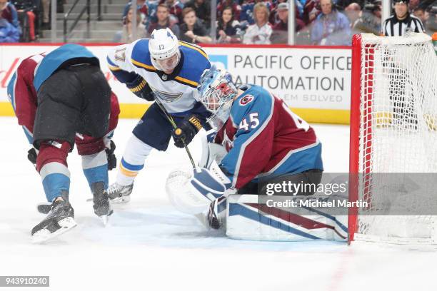 Goaltender Jonathan Bernier of the Colorado Avalanche makes a save against "nJaden Schwartz of the St. Louis Blues at the Pepsi Center on April 7,...