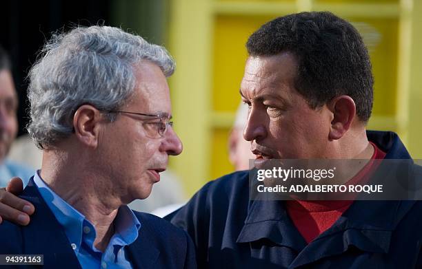 Brazilian intellectual and liberation theologist Frei Betto talks with Venezuelan President Hugo Chavez during a meeting to inaugurate the ALBA house...