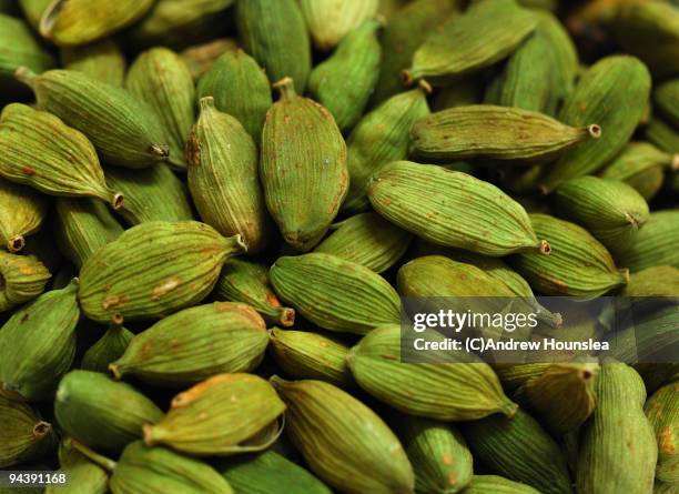 spice - green cardamom pods - close up view - cardamom stock pictures, royalty-free photos & images