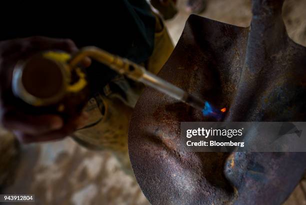 Mill worker melts a piece of gold in El Callao, Bolivar State, Venezuela, on Tuesday, Feb. 27, 2018. The military has been fighting for months to...