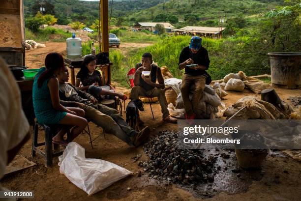 Workers sit inside a sand mill in El Callao, Bolivar State, Venezuela, on Tuesday, Feb. 27, 2018. The military has been fighting for months to master...