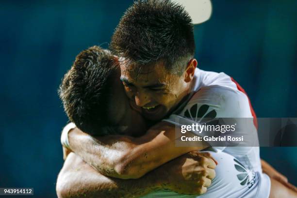 Rafael Santos Borre of River Plate celebrates with teammate Gonzalo Martinez after scoring the first goal of his team during a match between Racing...