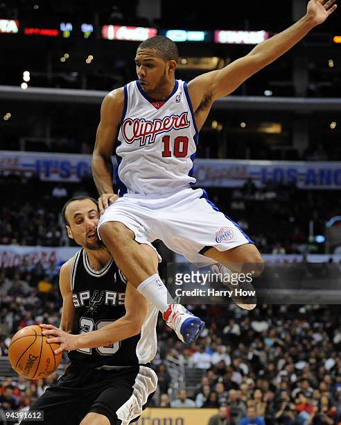 Manu Ginobili of the San Antonio Spurs takes a knee to the face from Eric Gordon of the Los Angeles Clippers at Staples Center on December 13, 2009...