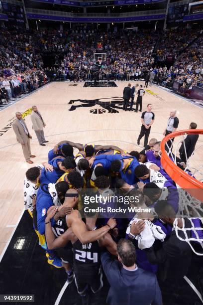 Players from the Golden State Warriors and Sacramento Kings gather together for a prayer for Patrick McCaw of the Golden State Warriors after exiting...