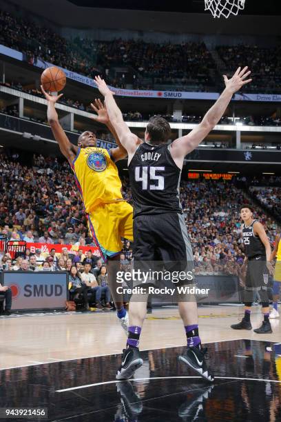 Kevon Looney of the Golden State Warriors puts up a shot against Jack Cooley of the Sacramento Kings on March 31, 2018 at Golden 1 Center in...