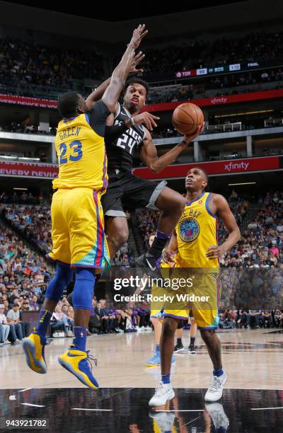 Buddy Hield of the Sacramento Kings goes up with the ball against Draymond Green of the Golden State Warriors on March 31, 2018 at Golden 1 Center in...