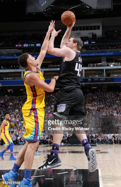 Jack Cooley of the Sacramento Kings shoots against Klay Thompson of the Golden State Warriors on March 31, 2018 at Golden 1 Center in Sacramento,...