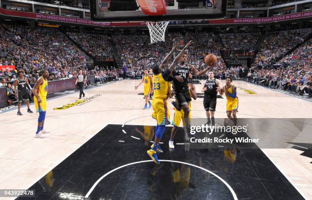 Buddy Hield of the Sacramento Kings goes up for the shot against Draymond Green of the Golden State Warriors on March 31, 2018 at Golden 1 Center in...