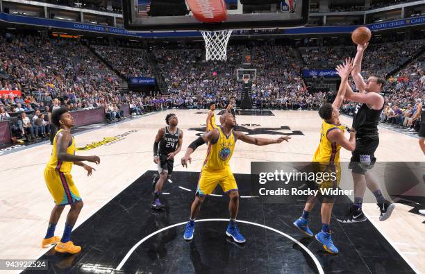 Jack Cooley of the Sacramento Kings shoots against Klay Thompson of the Golden State Warriors on March 31, 2018 at Golden 1 Center in Sacramento,...