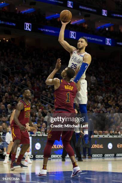 Ben Simmons of the Philadelphia 76ers shoots the ball against Rodney Hood of the Cleveland Cavaliers at the Wells Fargo Center on April 6, 2018 in...