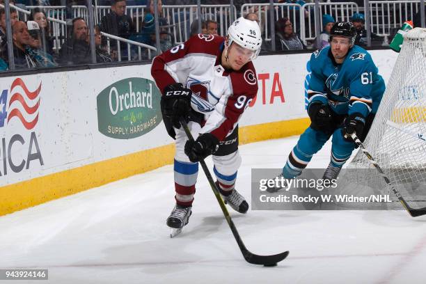 Mikko Rantanen of the Colorado Avalanche controls the puck against Justin Braun of the San Jose Sharks at SAP Center on April 5, 2018 in San Jose,...