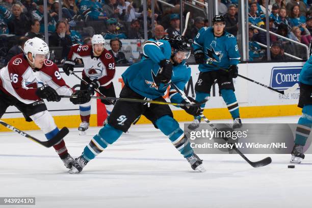 Marc-Edouard Vlasic of the San Jose Sharks skates against Mikko Rantanen of the Colorado Avalanche at SAP Center on April 5, 2018 in San Jose,...