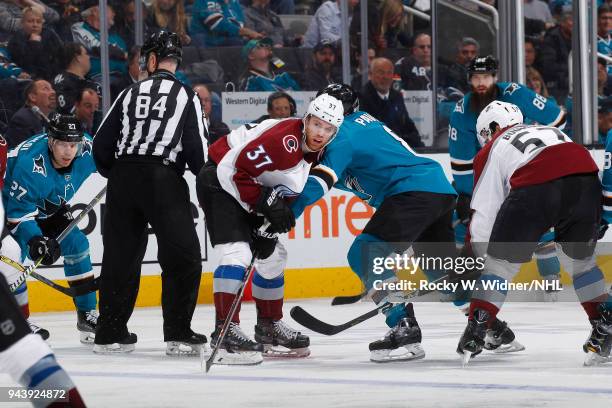 Compher of the Colorado Avalanche faces off against Joe Pavelski of the San Jose Sharks at SAP Center on April 5, 2018 in San Jose, California. J.T....