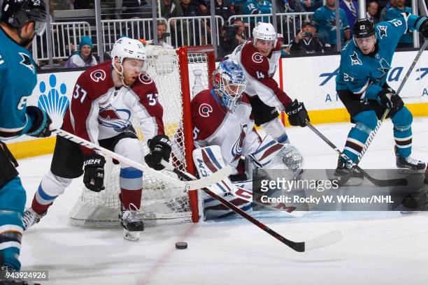 Compher and Jonathan Bernier of the Colorado Avalanche defend the net against the San Jose Sharks at SAP Center on April 5, 2018 in San Jose,...
