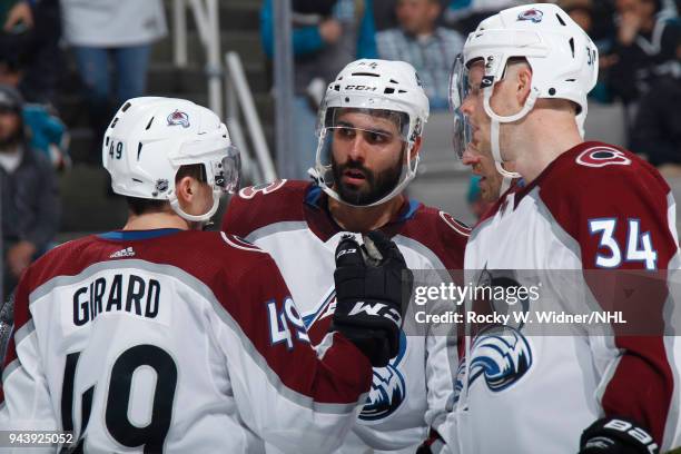 Samuel Girard, Mark Barberio and Carl Soderberg of the Colorado Avalanche talk during the game against the San Jose Sharks at SAP Center on April 5,...