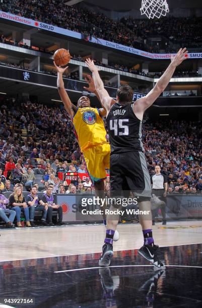 Kevon Looney of the Golden State Warriors shoots against Jack Cooley of the Sacramento Kings on March 31, 2018 at Golden 1 Center in Sacramento,...