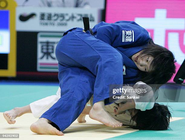 Misato Nakamura compete with Lien Pei-Ju at the second round match of Women's 52kg during the Grand Slam Tokyo 2009 International Judo Tournament at...