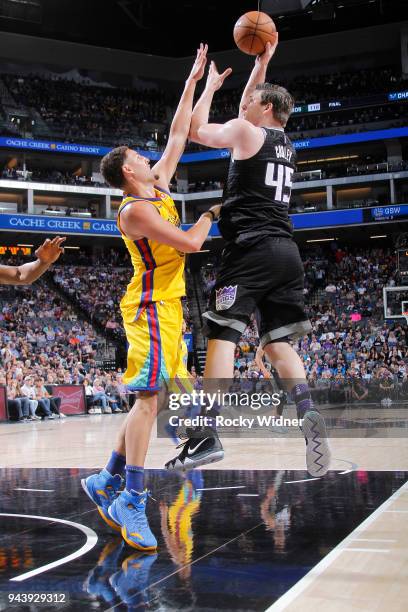 Jack Cooley of the Sacramento Kings shoots against Klay Thompson of the Golden State Warriors on March 31, 2018 at Golden 1 Center in Sacramento,...