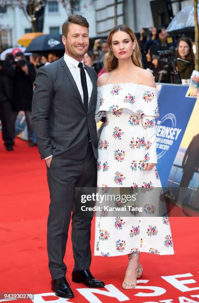 Glen Powell and Lily James attend 'The Guernsey Literary And Potato Peel Pie Society' World Premiere at The Curzon Mayfair on April 9, 2018 in...