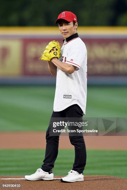 Japanese professional racing driving and Indy 500 winner Takuma Sato throws out the first pitch before a game between the Cleveland Indians and the...