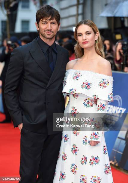 Michiel Huisman and Lily James attend 'The Guernsey Literary And Potato Peel Pie Society' World Premiere at The Curzon Mayfair on April 9, 2018 in...