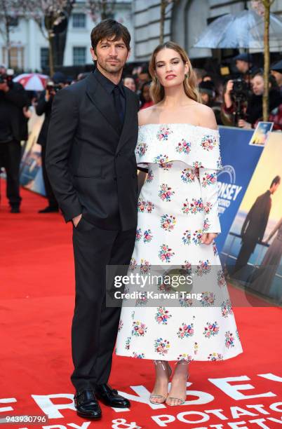 Michiel Huisman and Lily James attend 'The Guernsey Literary And Potato Peel Pie Society' World Premiere at The Curzon Mayfair on April 9, 2018 in...