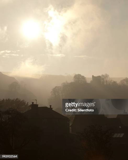 houses afore misty landscape with english castle - silentfoto sheffield fotografías e imágenes de stock