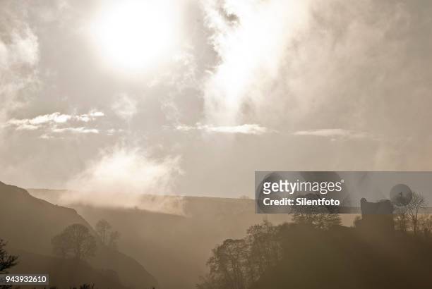 misty landscape with english castle on hill - silentfoto sheffield fotografías e imágenes de stock