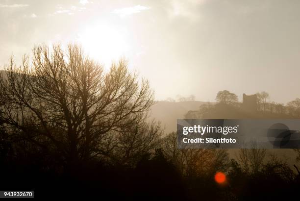 misty landscape with english castle on hill - silentfoto sheffield stock pictures, royalty-free photos & images