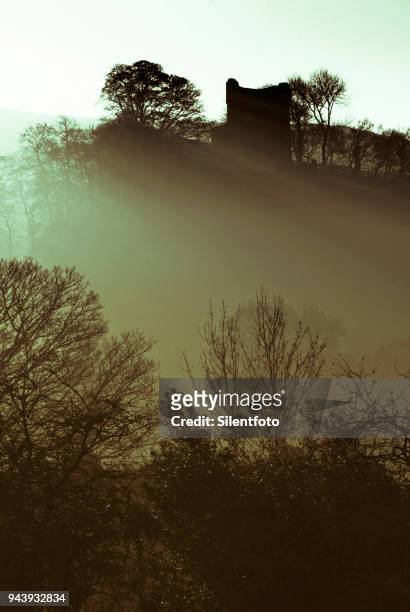 misty landscape with english castle on hill - silentfoto sheffield bildbanksfoton och bilder