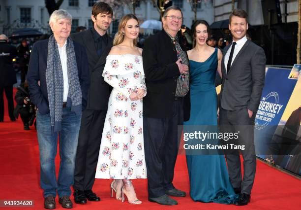 Sir Tom Courtenay, Michiel Huisman, Lily James, director Mike Newell, Jessica Brown Findlay and Glen Powell attend 'The Guernsey Literary And Potato...