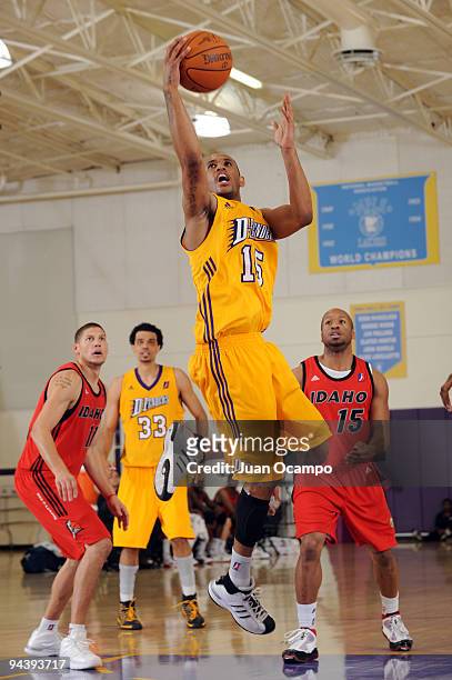 Gabe Pruitt of the Los Angeles D-Fenders goes to the basket against Roberto Bergersen and Sundiata Gaines of the Idaho Stampede during a D-League...