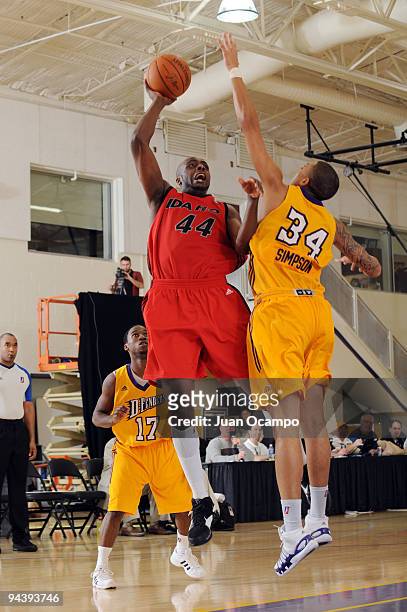 Anthony Tolliver of the Idaho Stampede shoots over Diamon Simpson of the Los Angeles D-Fenders during a D-League game on December 13, 2009 at the...