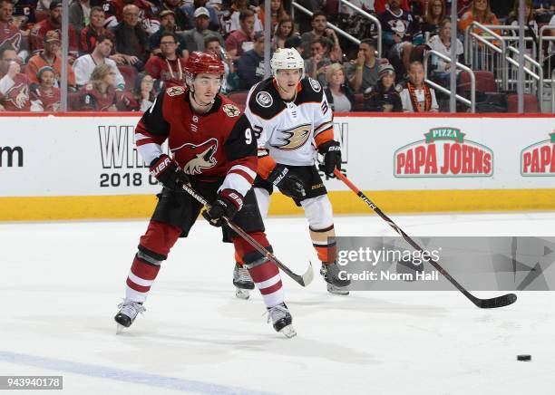 Clayton Keller of the Arizona Coyotes backhands a pass by Jakob Silfverberg of the Anaheim Ducks at Gila River Arena on April 7, 2018 in Glendale,...