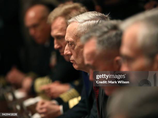 Secretary of Defense James Mattis , listens while President Donald Trump receives a briefing from senior military leaders regarding Syria, in the...