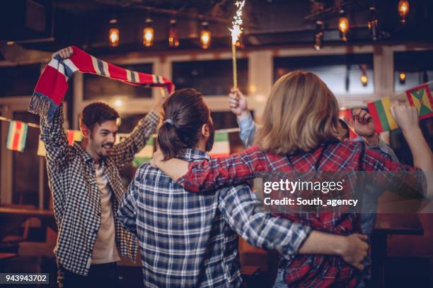 cheerful fans celebrating - child behind bars stock pictures, royalty-free photos & images