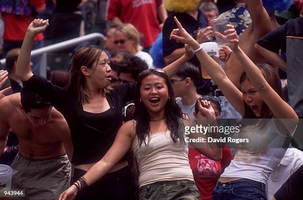 Fans enjoy themselves during the IRB World Sevens Series 2001 Hong Kong Sevens tournament held at the Hong Kong Stadium, in Hong Kong. \ Mandatory...