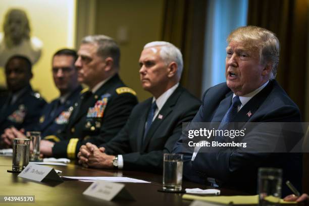 President Donald Trump, right, speaks during a meeting with senior military leadership in the Cabinet Room of the White House in Washington, D.C.,...