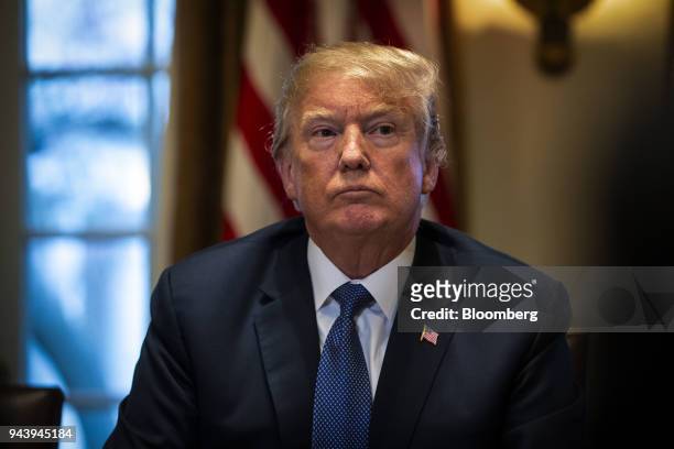 President Donald Trump listens during a meeting with senior military leadership in the Cabinet Room of the White House in Washington, D.C., U.S., on...