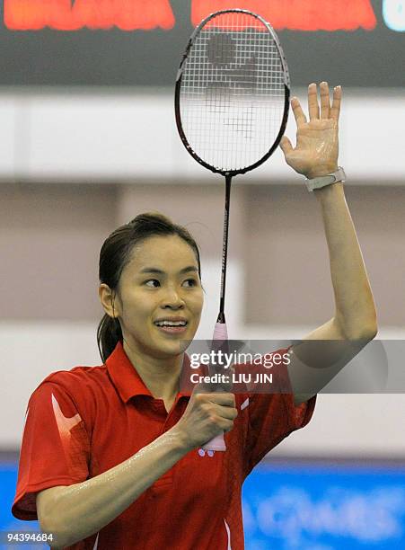 Malaysia's Wong Mew Choo celebrates after beating Adriyanti Firdasari of Indonesia in their women's singles match of the women's team badminton...