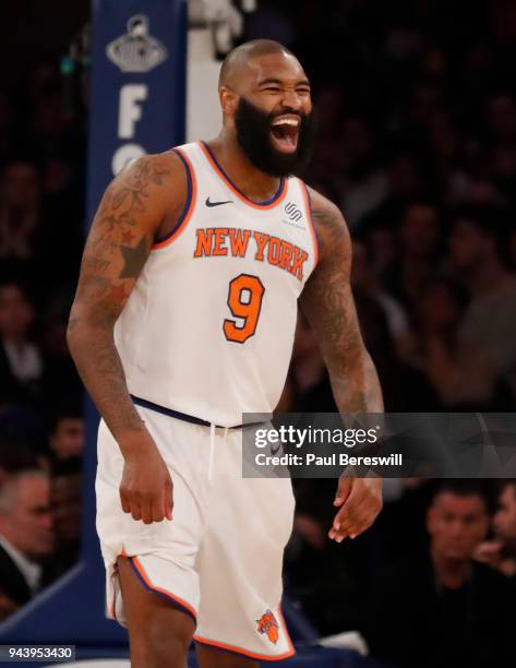 Kyle O'Quinn of the New York Knicks reacts laughing after he sunk a three point shot in an NBA basketball game against the Miami Heat on April 6,...