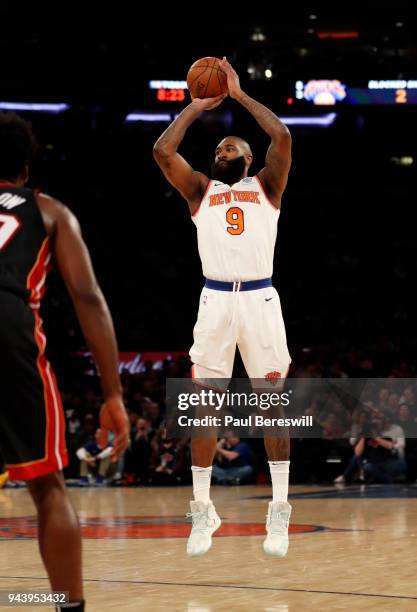 Kyle O'Quinn of the New York Knicks shoots and sinks a three point shot in an NBA basketball game against the Miami Heat on April 6, 2018 at Madison...