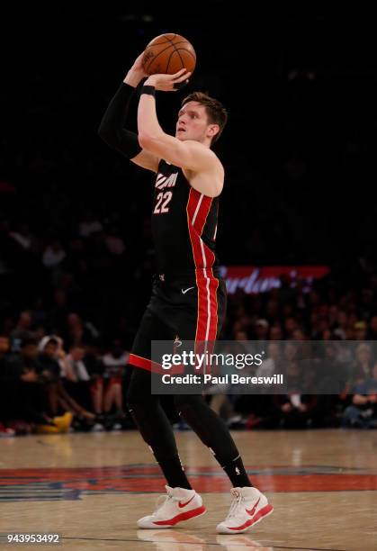 Luke Babbitt of the Miami Heat shoots a three point shot in an NBA basketball game against the New York Knicks on April 6, 2018 at Madison Square...