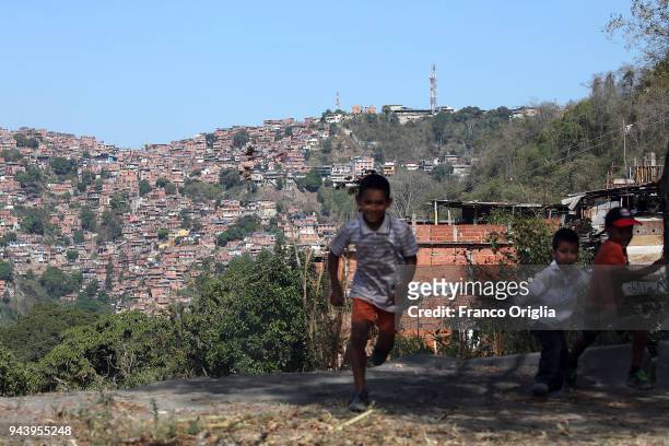 Children play in a barrio of Caracas on April 9, 2018 in Caracas, Venezuela. Venezuela is in the midst of an unprecedented economic and political...
