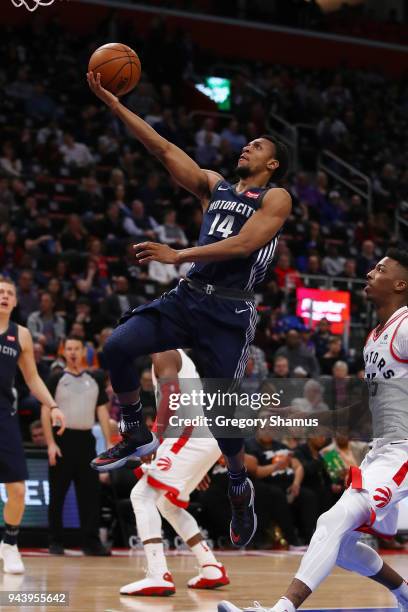 Ish Smith of the Detroit Pistons drives to the basket past Delon Wright of the Toronto Raptors during the first half at Little Caesars Arena on April...