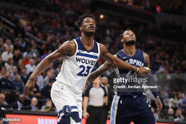 Karl-Anthony Towns of the Minnesota Timberwolves and Ben McLemore of the Memphis Grizzlies box out during the game between the two teams on April 9,...