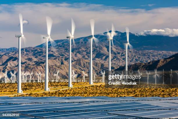 wind turbines and solar panels - california power lines stock pictures, royalty-free photos & images