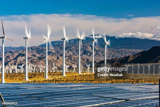 wind turbines and solar panels - california power lines stock pictures, royalty-free photos & images